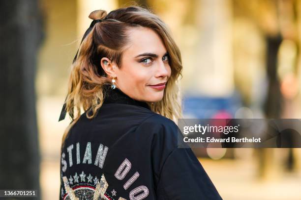 Cara Delevingne is seen, outside Dior, during Paris Fashion Week - Haute Couture Spring/Summer 2022, on January 24, 2022 in Paris, France.