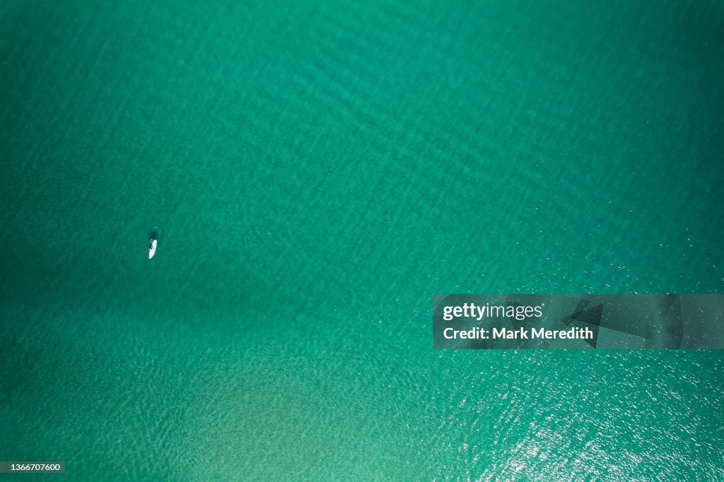 Drone view of paddleboarder