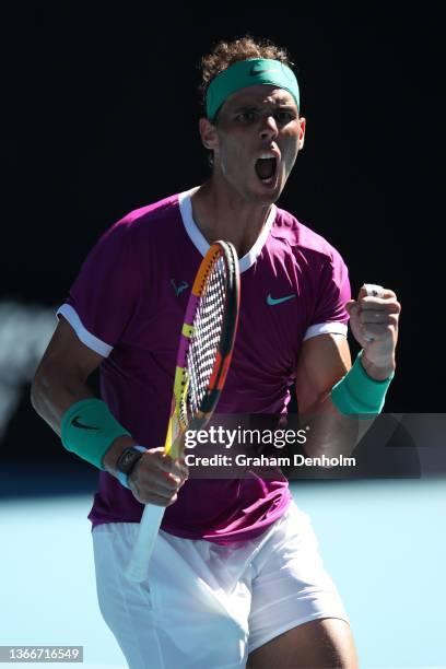 Rafael Nadal of Spain celebrates a point in his Men's Singles Quarterfinals match against Denis Shapovalov of Canada during day nine of the 2022...