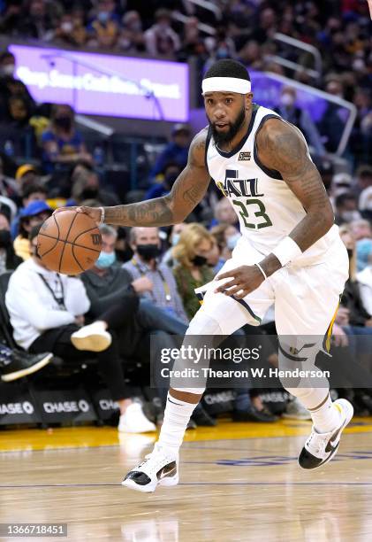 Royce O'Neale of the Utah Jazz dribbling the ball up court against the Golden State Warriors during the second half of an NBA basketball game at...