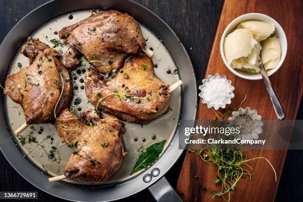 duck leg confit in a skillet - confit stock pictures, royalty-free photos & images