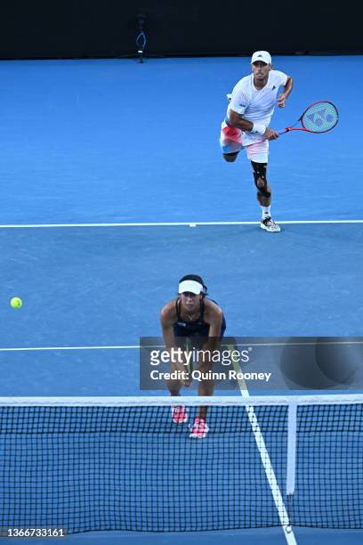 Ben McLachlan of Japan serves in his Mixed Doubles Quarterfinals match with Ena Shibahara of Japan against John Peers of Australia and Shuai Zhang of...