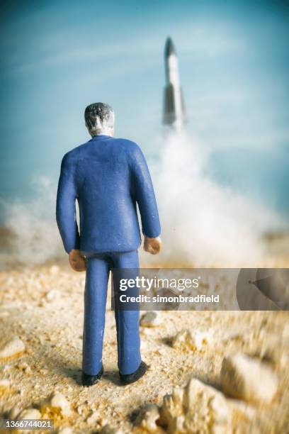 watching a rocket launch in miniature - intercontinental ballistic missile stock pictures, royalty-free photos & images