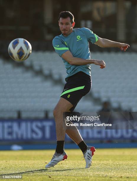Ryan McGowan of Australia kicks the ball during an Australian Socceroos training session at Lakeside Stadium on January 25, 2022 in Melbourne,...
