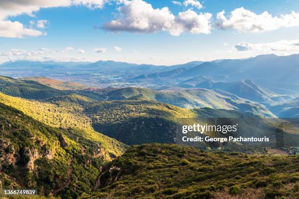 green mountains during the day and sky with a few clouds. - arcadia greece stock pictures, royalty-free photos & images