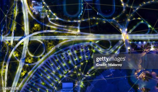 blockchain network spanning across a city, stadium, parking lot and nearby highway. smart city - chain technology foto e immagini stock