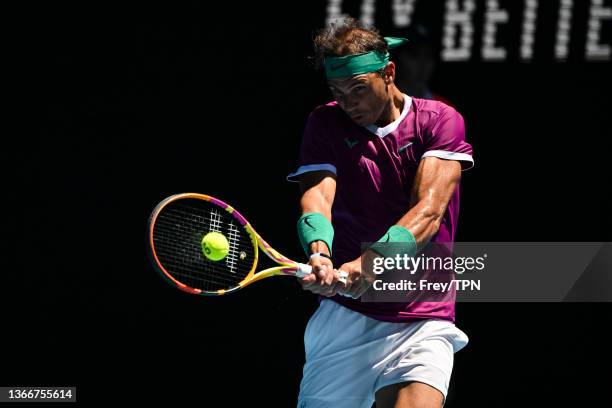 Rafael Nadal of Spain hits a backhand against Denis Shapovalov of Canada during day nine of the 2022 Australian Open at Melbourne Park on January 25,...