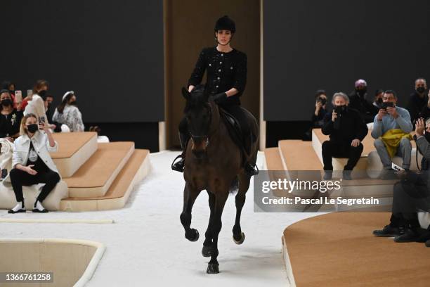 Charlotte Casiraghi rides a horse on the runway during the Chanel Haute Couture Spring/Summer 2022 show as part of Paris Fashion Week at Le Grand...