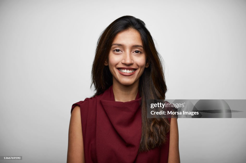 Portrait of Indian Young Businesswoman Standing in Front of White Background