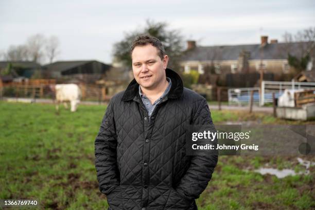 waist-up portrait of early 40s farmer standing in pasture - welsh culture stock pictures, royalty-free photos & images