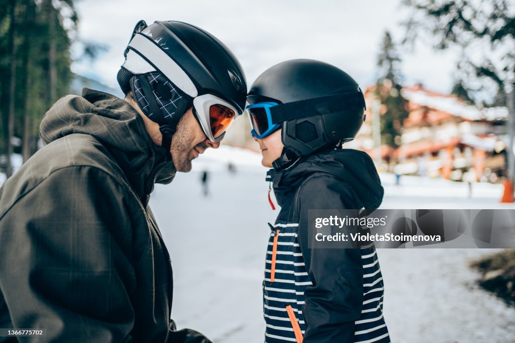 Father and son on winter vacation in the mountain.