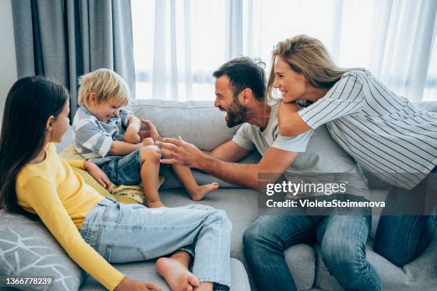 happy family at home. - family at home stock pictures, royalty-free photos & images