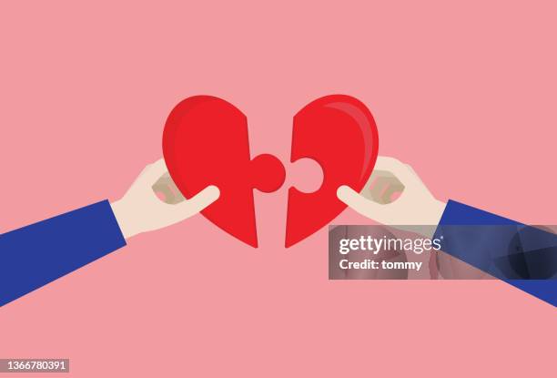 hand holding a heart shaped jigsaw - work romance stock illustrations