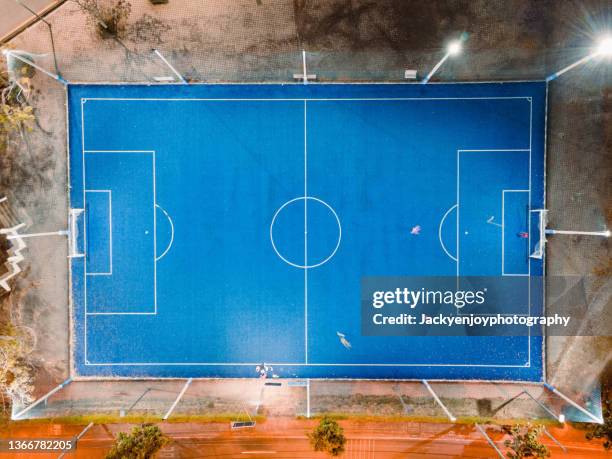 aerial view of empty soccer field at night in rayong ,thailand - soccer field above stock pictures, royalty-free photos & images