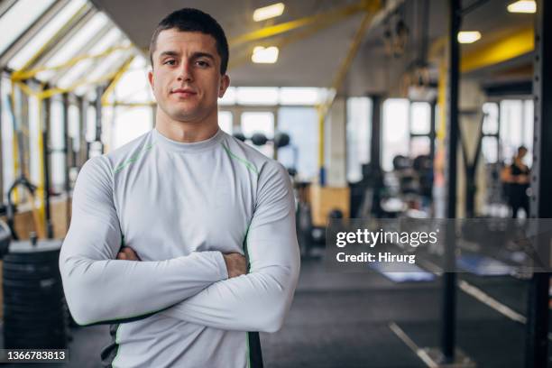 male fitness trainer in gym - athlete stock pictures, royalty-free photos & images