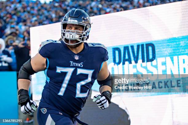 David Quessenberry of the Tennessee Titans runs onto the field during introductions before a game against the Cincinnati Bengals in the AFC...