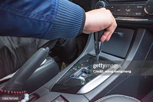 operating gearshift lever of automobile gearbox - accelerator stock pictures, royalty-free photos & images