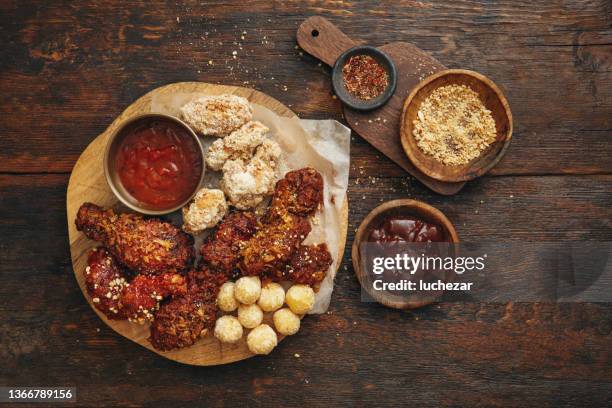 asian-style barbecue chicken drumsticks and wings - gourmet chicken stock pictures, royalty-free photos & images