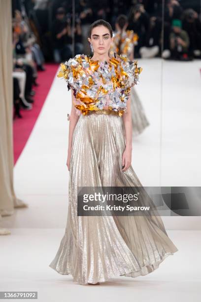 Model walks the runway during the Alexis Mabille Haute Couture Spring/Summer 2022 show as part of Paris Fashion Week at salle Pleyel on January 25,...