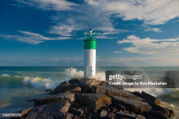 lake ontario -lighthouse and waves - lake ontario stock pictures, royalty-free photos & images