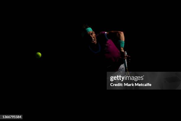 Rafael Nadal of Spain serve in his Men's Singles Quarterfinals match against Denis Shapovalov of Canada during day nine of the 2022 Australian Open...