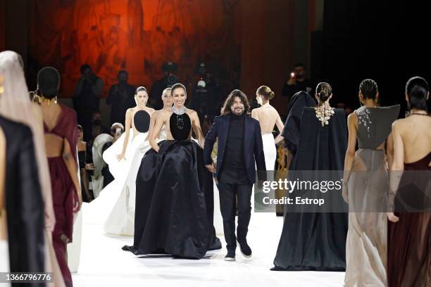 Nieves Àlvarez and Stéphane Rolland walks the runway during the Stephane Rolland Haute Couture Spring/Summer 2022 show as part of Paris Fashion Week...