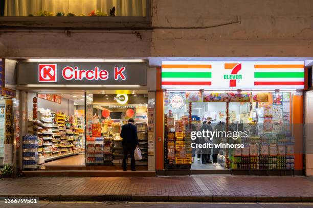 circle k and 7-eleven convenience stores - hong kong street food stock pictures, royalty-free photos & images