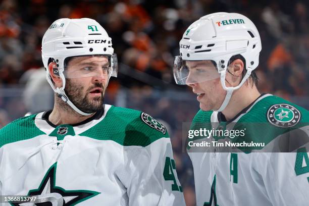 Alexander Radulov and Miro Heiskanen of the Dallas Stars speak during the second period against the Philadelphia Flyers at Wells Fargo Center on...