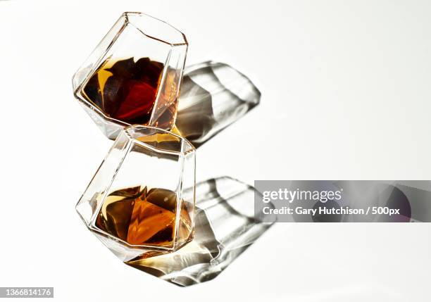 close-up of whiskey in glass against white background,indiana,united states,usa - cognac fotografías e imágenes de stock