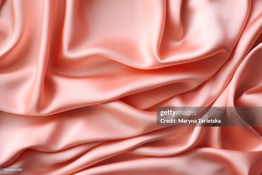 Universal abstract satin background in pink color. Universal background. Satin background. Atlas pink.