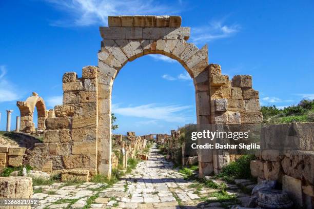 arch of tiberius - ruins of leptis magna stock pictures, royalty-free photos & images