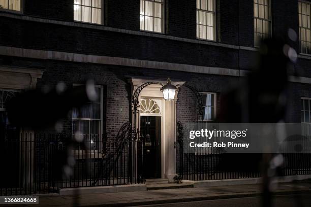 Downing Street is seen between a pair of TV lights at Downing Street on January 25, 2022 in London, England. The Met Police have announced an...