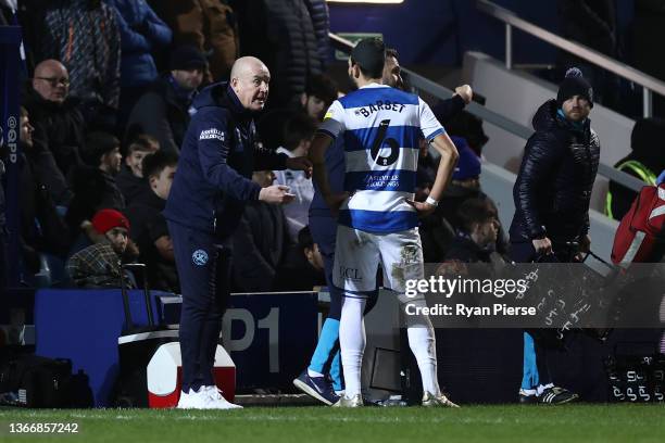 Manager Mark Warburton talks with Yoann Barbet of Queens Park Rangers during the Sky Bet Championship match between Queens Park Rangers and Swansea...