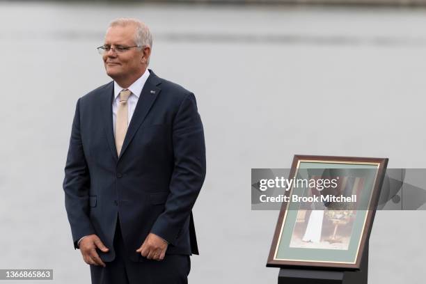 Australian Prime Minister Scott Morrison stands next to a portrait of Queen Elizabeth at the Citizenship and Flag Raising Ceremony on January 26,...