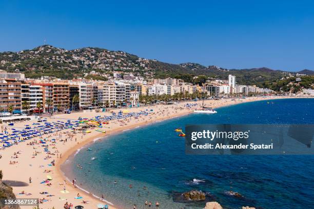 aerial view of beach in lloret de mar, costa brava, spain - provinz barcelona stock-fotos und bilder