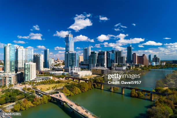 austin downtown skyline aerial view with lake and blue sky - austin texas city stock pictures, royalty-free photos & images