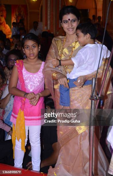 Kajol Devgn and his daughter Nysa Devgan and son Yug Devgan attend the North bombay sarbojanik durga Puja festivel on October 21,2012 in Mumbai,...
