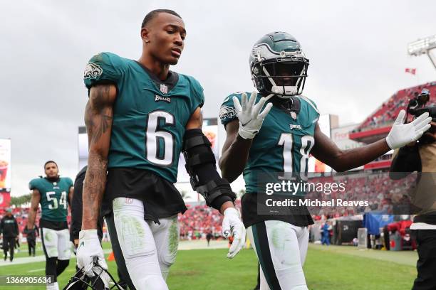 DeVonta Smith and Jalen Reagor of the Philadelphia Eagles reacts after losing the NFC Wild Card Playoff game against the Tampa Bay Buccaneers at...