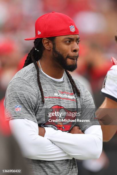 Richard Sherman of the Tampa Bay Buccaneers looks on from the sideline against the Philadelphia Eagles in the first half of the NFC Wild Card Playoff...