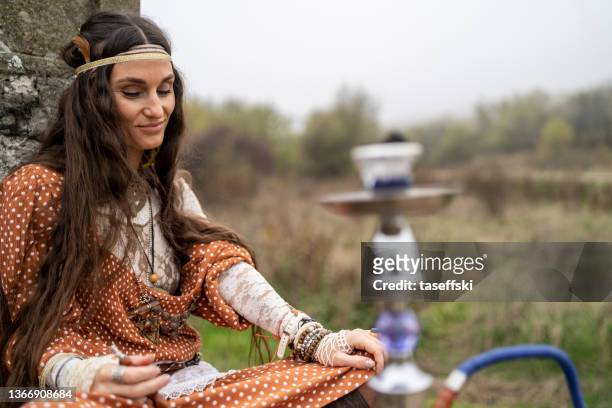 hippie smoking hookah - hookah stock pictures, royalty-free photos & images