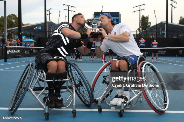 Alfie Hewett and Gordon Reid of Great Britain kiss the trophy after their victory in the Men's Wheelchair Doubles Final match against Gustavo...