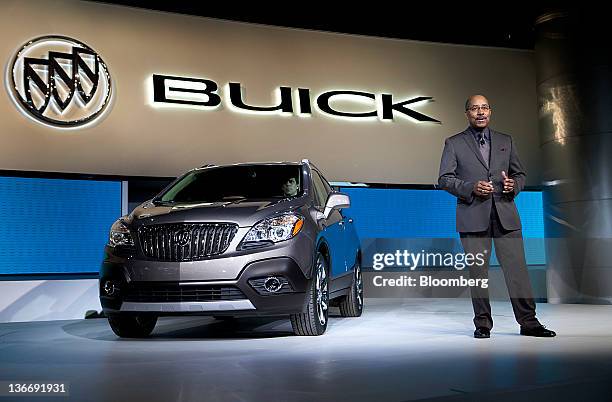 Ed Welburn, vice president of global design at General Motors Co. , speaks about the Buick Encore compact crossover sports utility vehicle during the...
