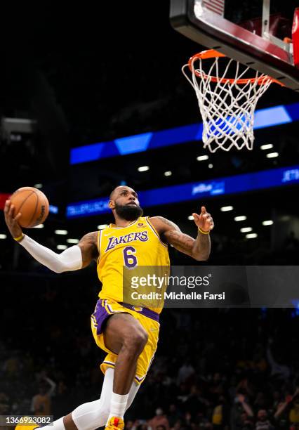 LeBron James of the Los Angeles Lakers dunks against the Brooklyn Nets during their Chinese New Year celebration at Barclays Center on January 25,...