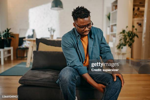 young black man having pain - cartilage bildbanksfoton och bilder