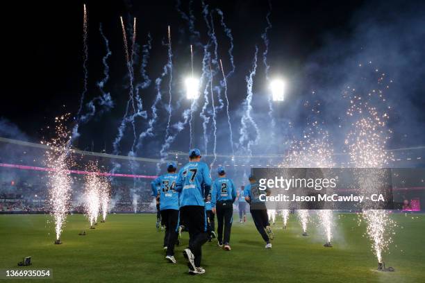 Strikers players take to field during the Men's Big Bash League match between the Sydney Sixers and the Adelaide Strikers at Sydney Cricket Ground,...