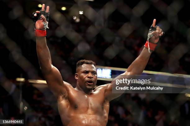 Francis Ngannou of Cameroon celebrates after defeating Ciryl Gane of France by unanimous decision in their heavyweight title fight during the UFC 270...