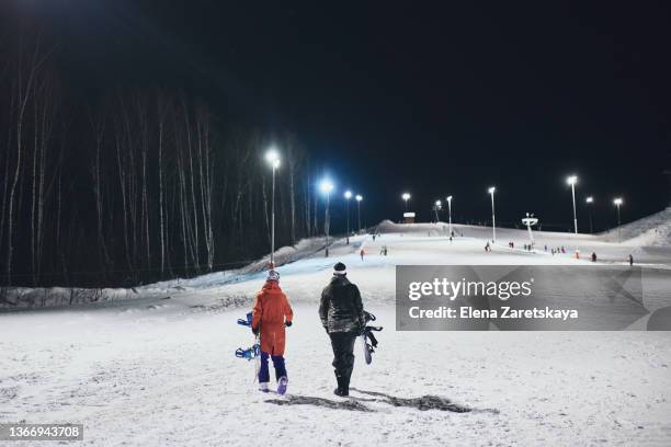 snowboarder and instructor - woman snowboarding stock pictures, royalty-free photos & images