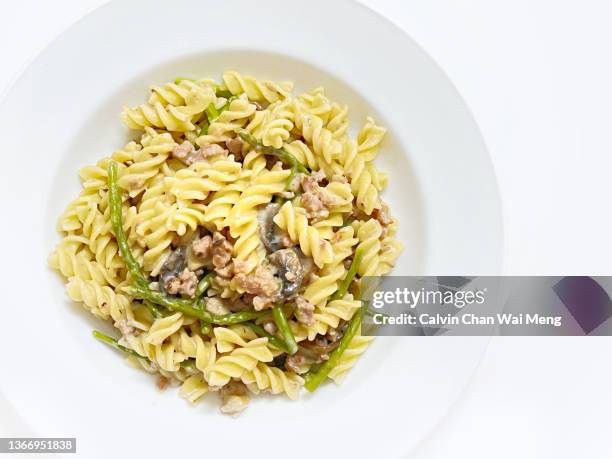 fusilli pasta with mushrooms, bacon and asparagus - spiral ham stock pictures, royalty-free photos & images