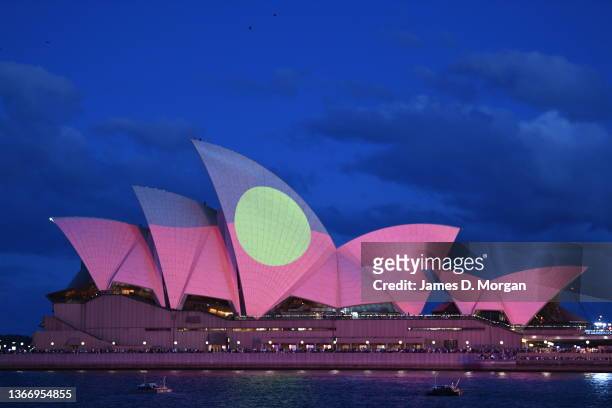 The Aboriginal flag is projected onto the sails of the Opera House during the Australia Day Live concert on January 26, 2022 in Sydney, Australia....