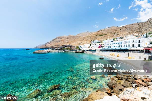 greek buildings by the sea, hora sfakion, crete - creta fotografías e imágenes de stock